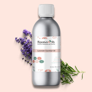 Raasa Oils lavender essential oil bottle with lavender flowers and rosemary on a light pink background