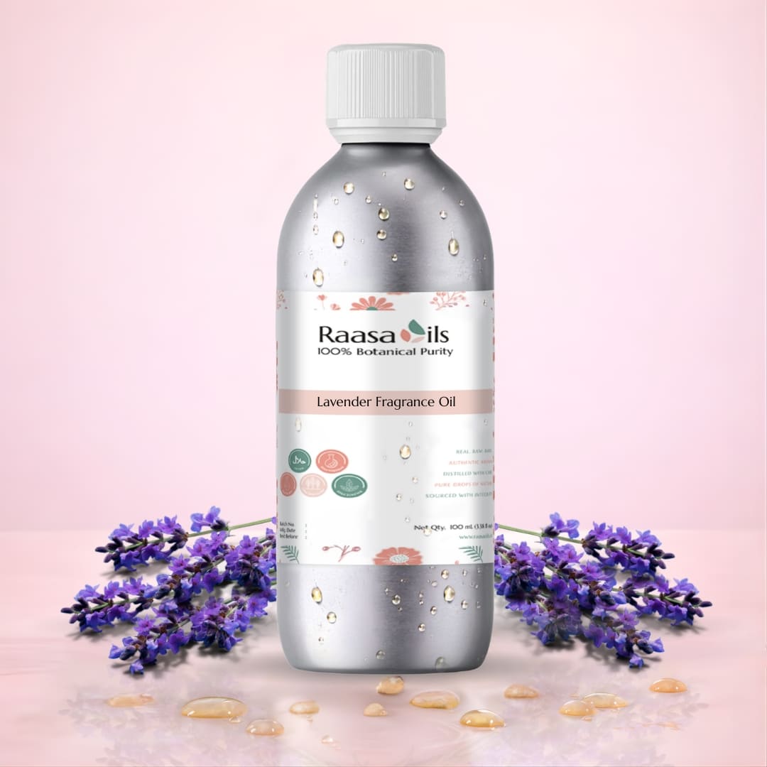 Bottle of Raasa Oils Lavender Fragrance Oil with lavender flowers on a pink background