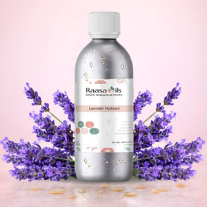 Raasa Oils Lavender Hydrosol bottle with lavender flowers on a pink background