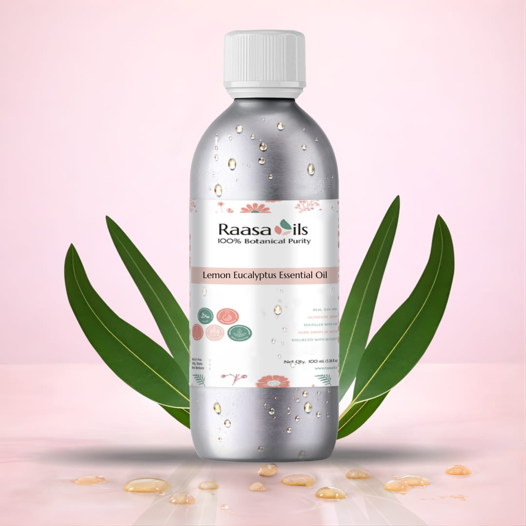Raasa Oils Lemon Eucalyptus Essential Oil bottle with leaves on a pink background