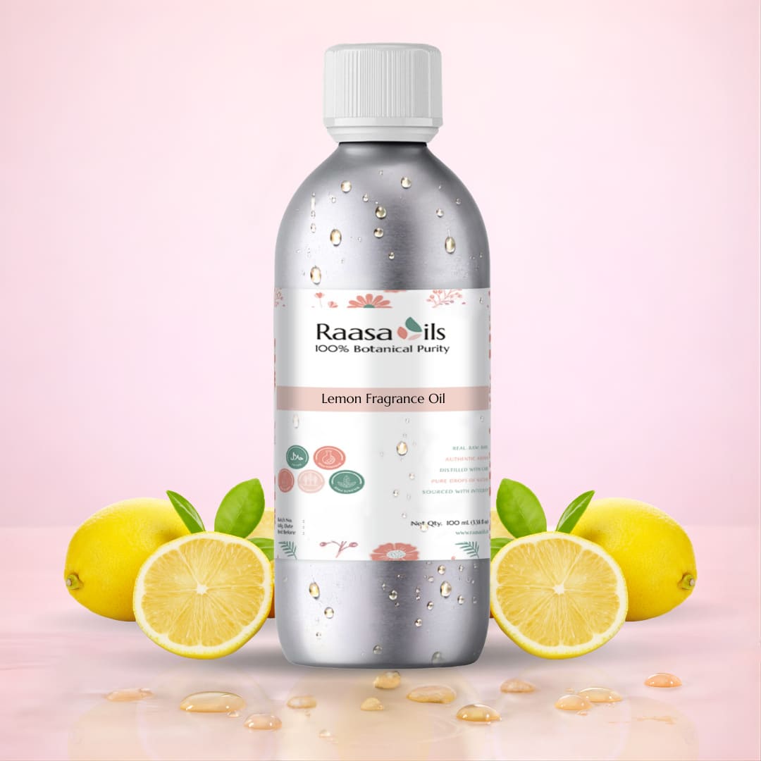 Bottle of Raasa Oils Lemon Fragrance Oil with lemons on a pink background