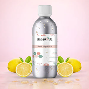Bottle of Raasa Oils Lemon Fragrance Oil with lemons on a pink background