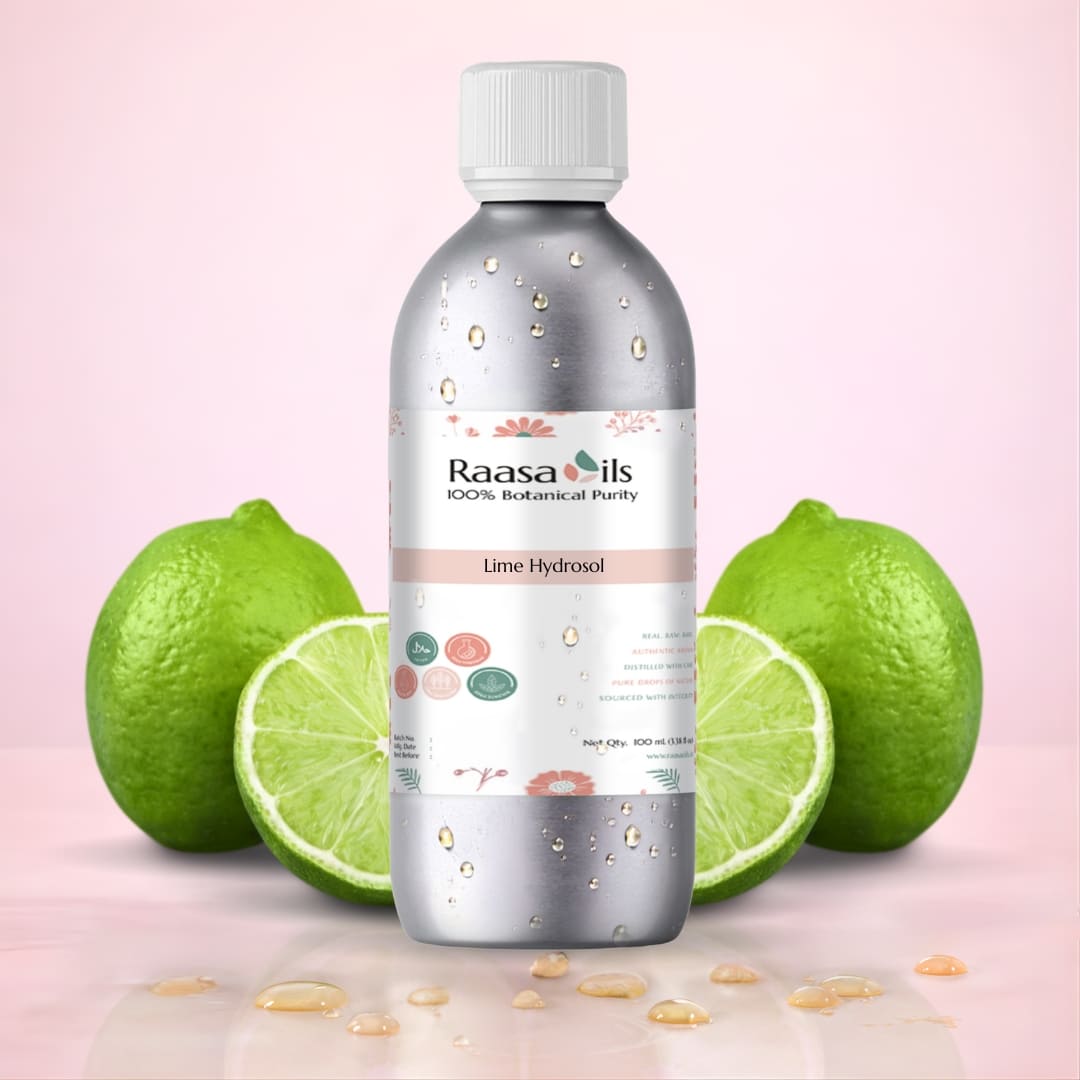 Bottle of Raasa Oils Lime Hydrocol with lime fruits on a pink background