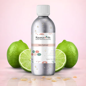 Bottle of Raasa Oils Lime Hydrocol with lime fruits on a pink background