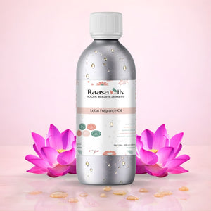 Raasa Oils Lotus Fragrance Oil bottle with pink flower and green leaves on a light pink background