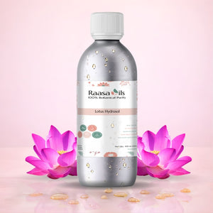 Raasa Oils bottle with pink lotus flowers on a light pink background
