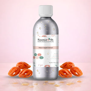 Bottle of Raasa Oils Mace Liquid Extract with mace fruits on a pink background