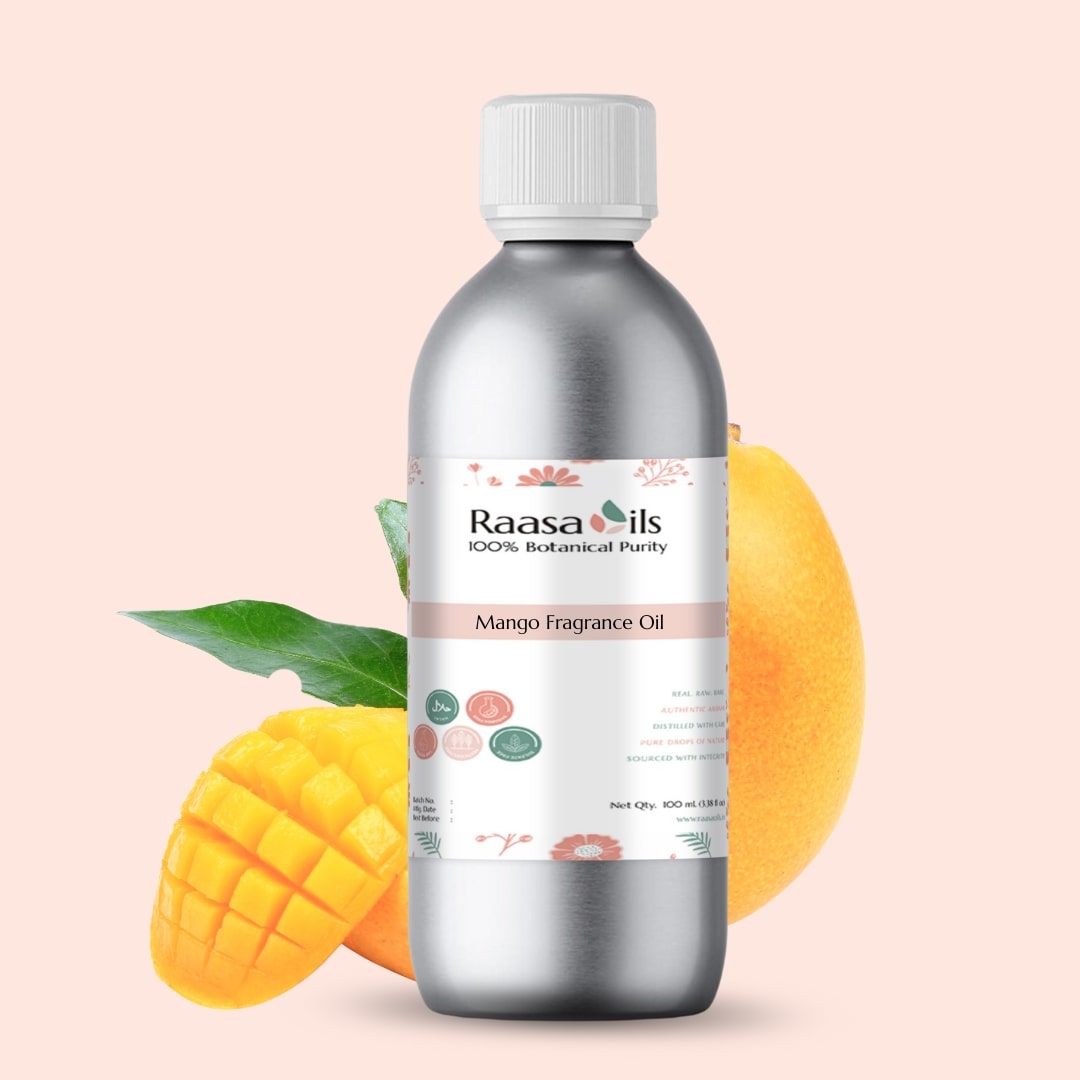 Bottle of Raasa Oils Mango Fragrance Oil with mangoes on a light pink background
