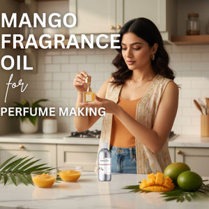Woman holding a bottle of mango fragrance oil with ingredients on a kitchen counter.