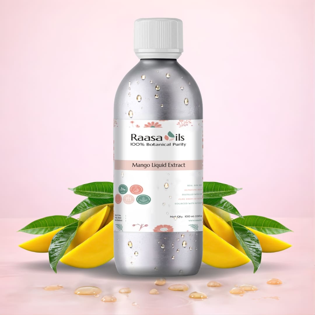 Bottle of Raasa Oils Mango Liquid Extract with mangoes and leaves on a pink background