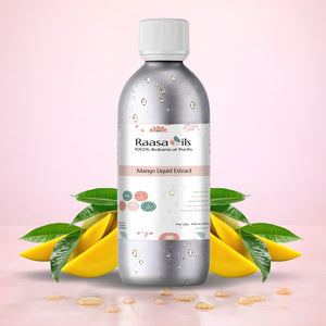 Bottle of Raasa Oils Mango Liquid Extract with mangoes and leaves on a pink background