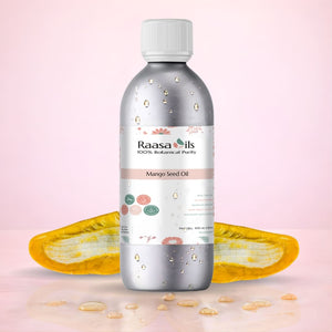 Bottle of Raasa Oils Mango Seed Oil with a pink gradient background
