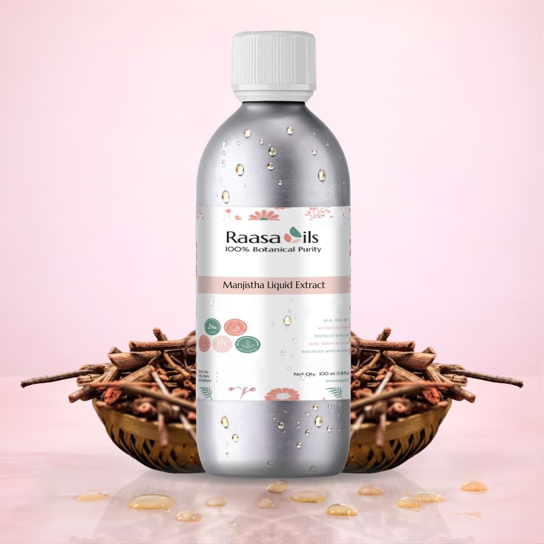 Bottle of Raasa Oils Manjistha Liquid Extract with dried roots on a pink background