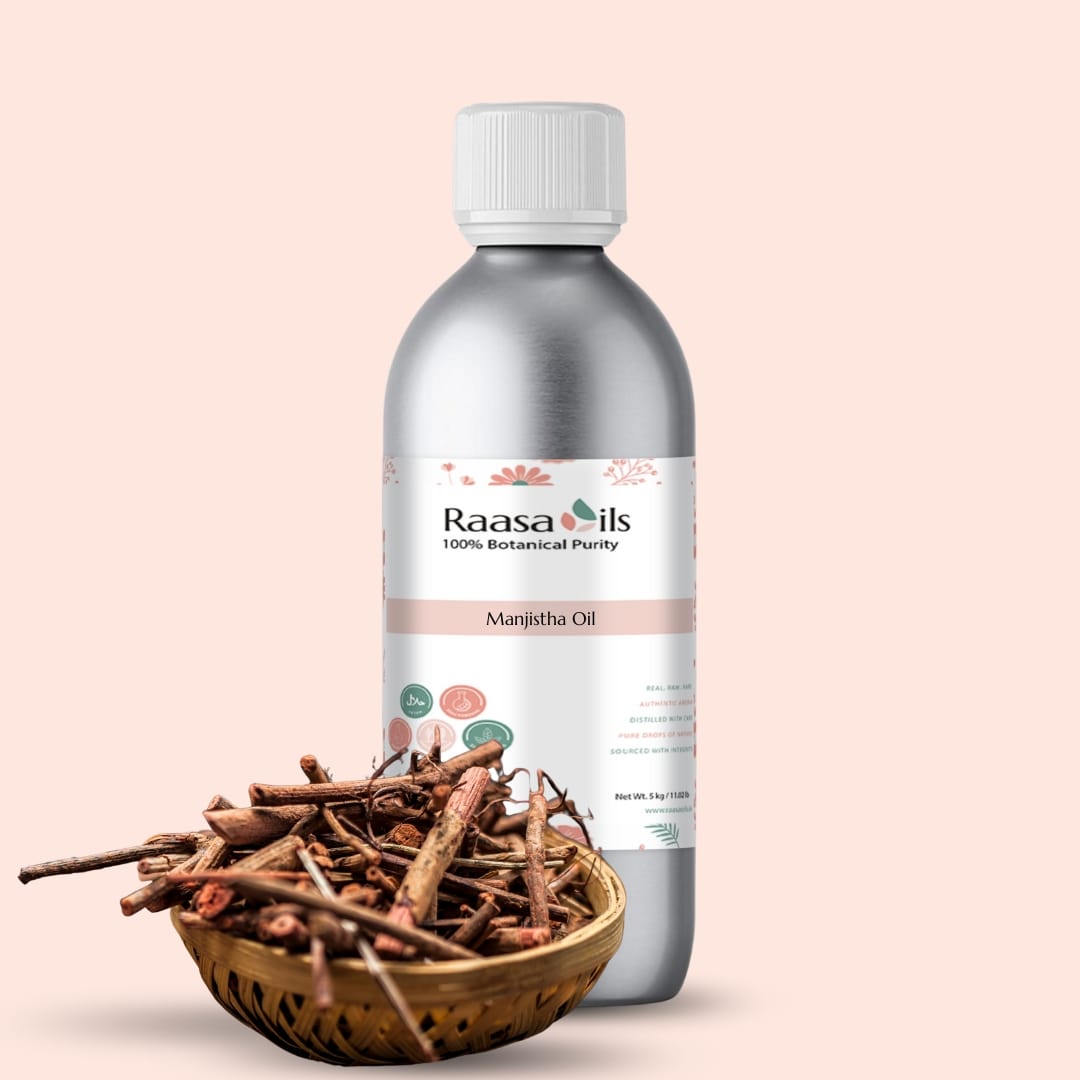 Raasa Oils Manjitha Oil bottle with a bowl of cinnamon sticks on a beige background