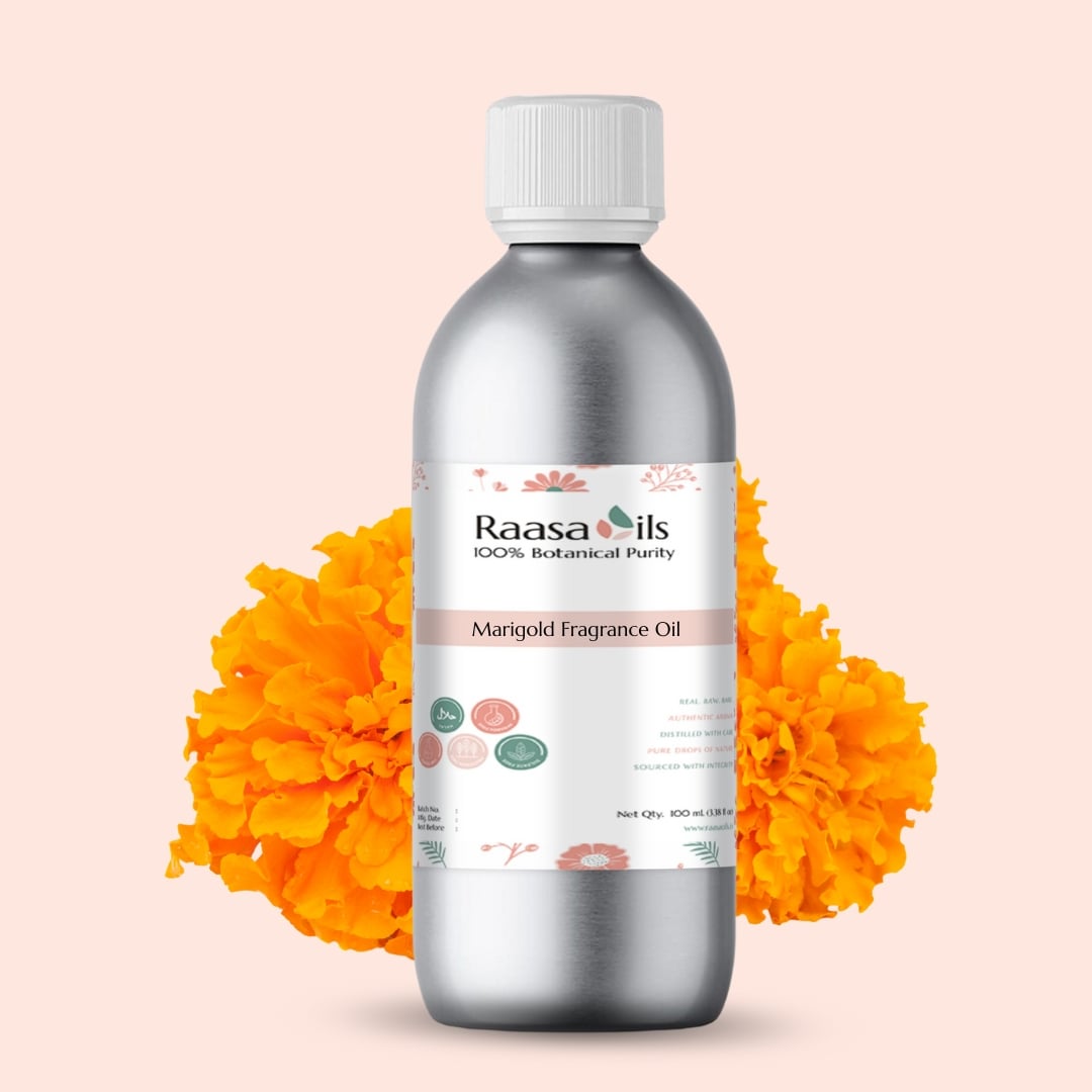 Bottle of Raasa Oils Marigold Fragrance Oil with marigold flowers on a light pink background