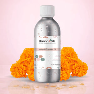 Raasa Oils Marigold Fragrance Oil bottle with marigold flowers on a pink background