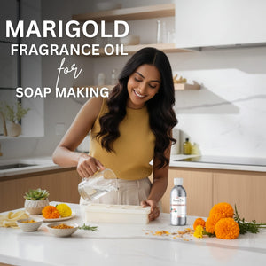 Woman in a kitchen preparing soap with marigold flowers and a bottle of Marigold fragrance oil.