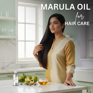 Woman with long hair standing in a kitchen with marula oil products on the counter.