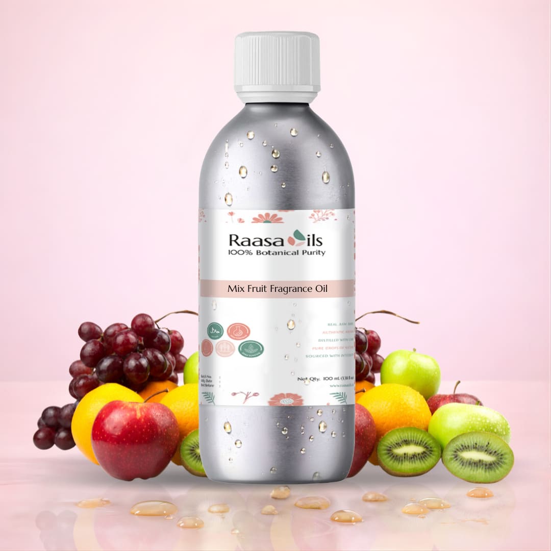 Bottle of Raasa Oils Mix Fruit Fragrance Oil with fruits on a pink background