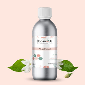 Bottle of Raasa Oils Mogra Hydrosol with floral and leaf elements on a light pink background