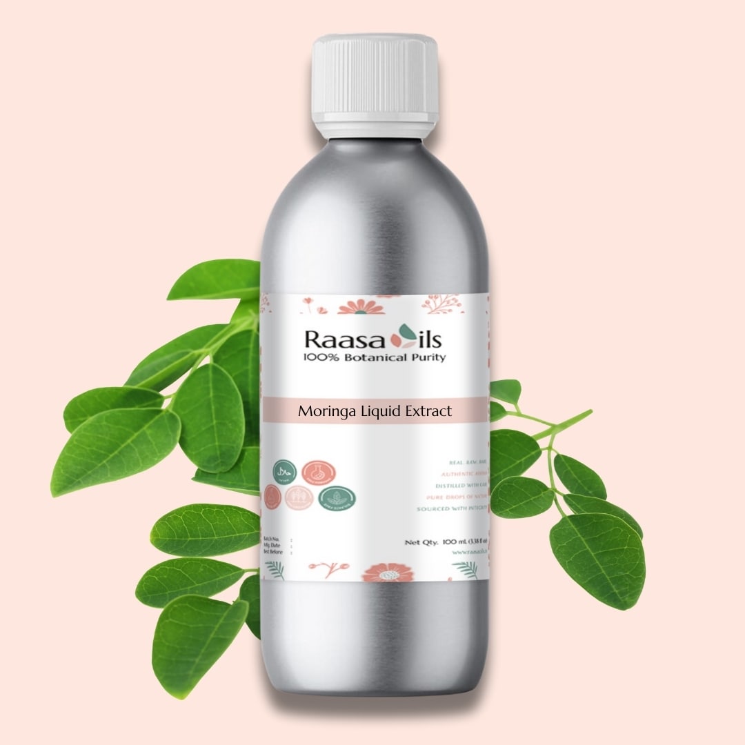 Bottle of Raasa Oils Moringa Liquid Extract with green leaves on a pink background