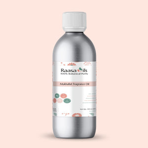 Bottle of Raasa Oils Mukhallat Fragrance Oil on a light pink background