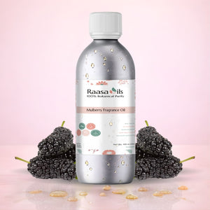 Bottle of Raasa Oils Mulberry Fragrance Oil with mulberries on a pink background