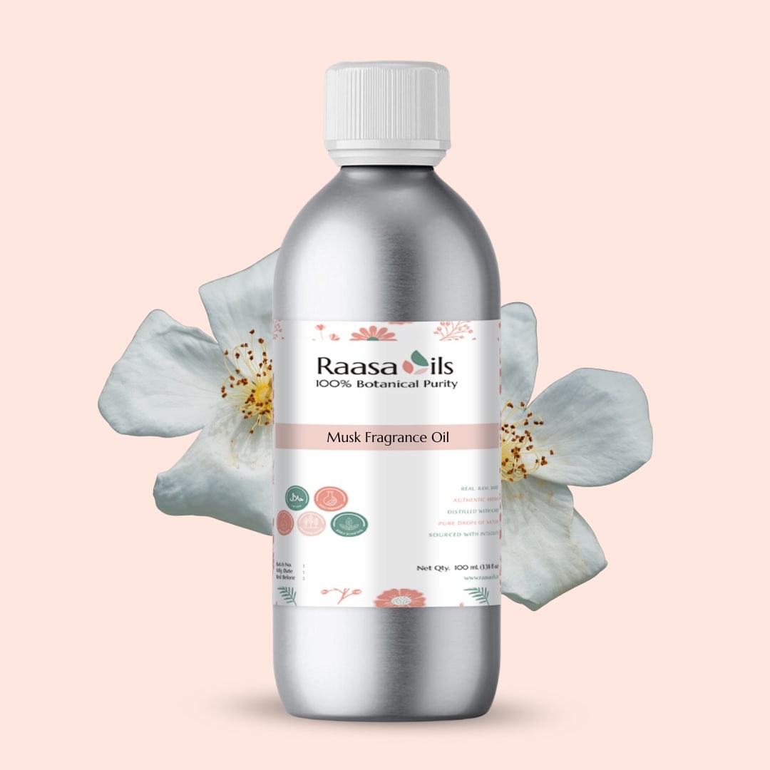 Raasa Oils Musk Fragrance Oil bottle with flowers on a light pink background
