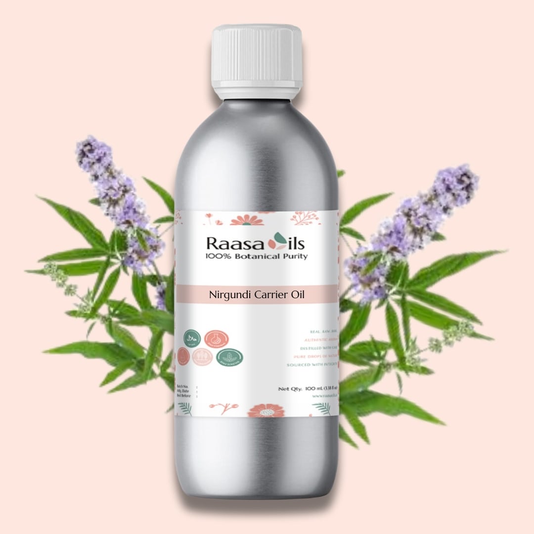 Raasa Oils Nirgundi Carrier Oil bottle with lavender flowers on a pink background