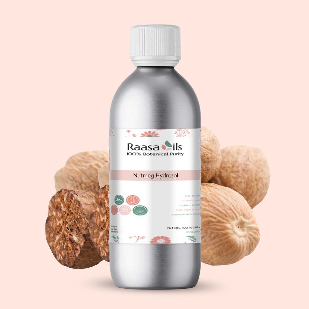 Bottle of Raasa Oils Nutmeg Hydrofol with nutmeg fruits on a beige background