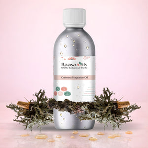 Bottle of Raasa Oils Oakmoss Fragrance Oil with natural elements on a pink background