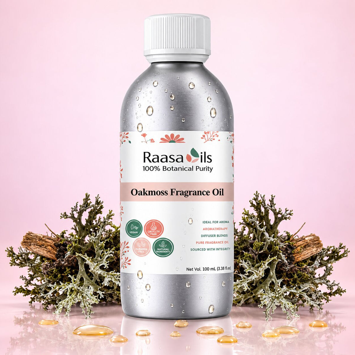 A bottle of Raasa Oils Oakmoss Fragrance Oil centered on a soft pink background, surrounded by botanical props including green moss, cinnamon sticks, and small droplets of oil on a reflective surface.