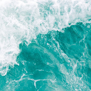 Close-up of turquoise ocean water with white foam