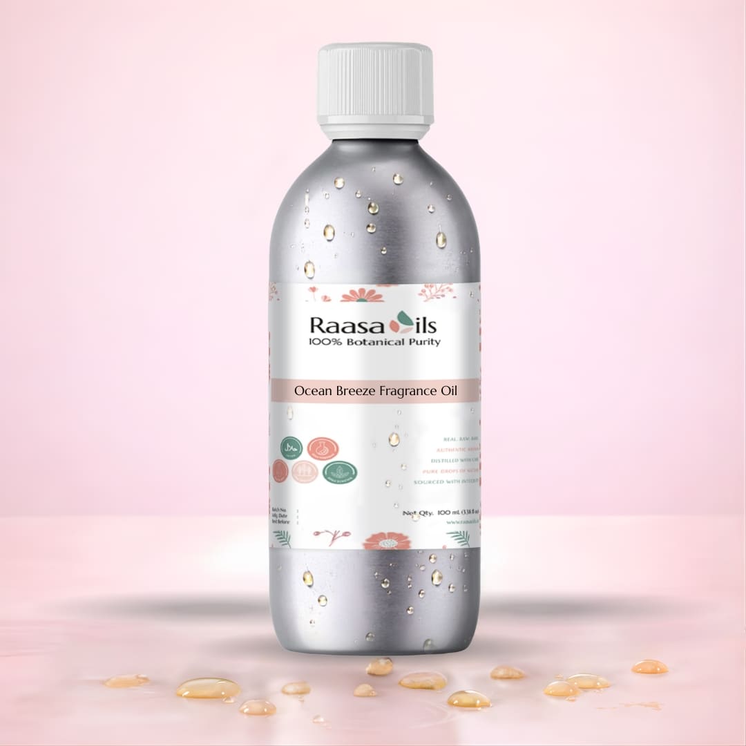 Bottle of Raasa Oils Ocean Breeze Fragrance Oil on a pink background
