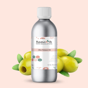 Bottle of Raasa Oils Olive Pomace Oil with olive fruits on a beige background