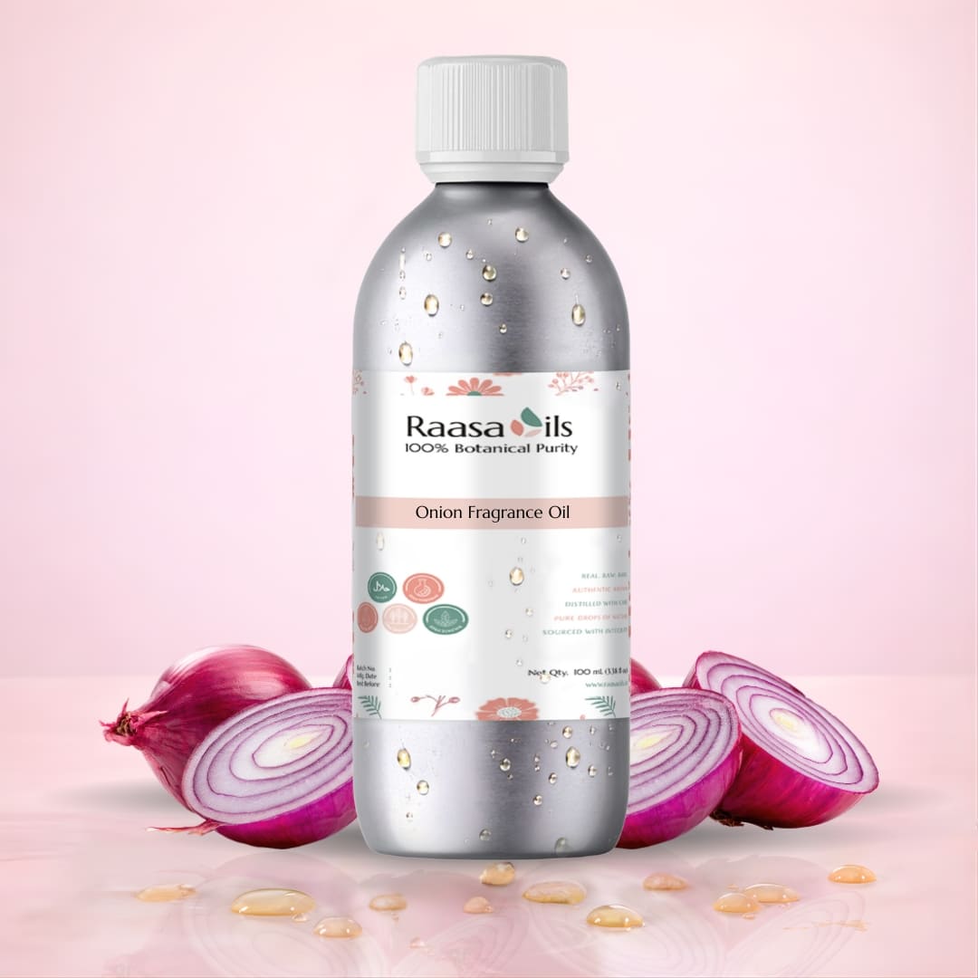 Bottle of Raasa Oils Onion Fragrance Oil with onions on a pink background