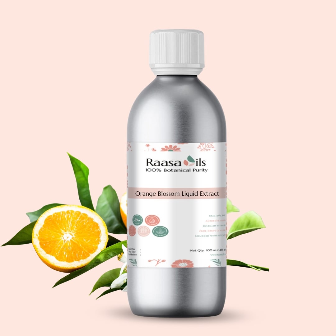 Bottle of Raasa Oils Orange Blossom Liquid Extract with orange and leaves on a light pink background