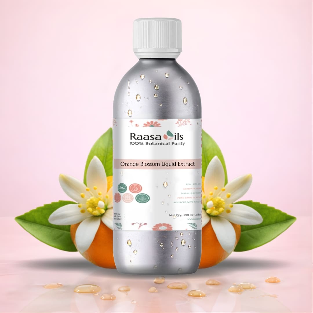 Bottle of Raasa Oils Orange Blossom Liquid Extract with flowers and leaves on a pink background