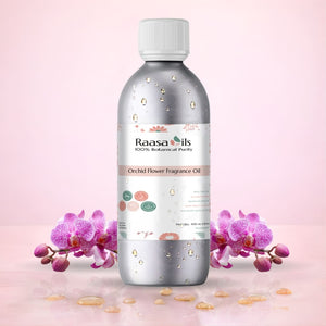 Bottle of Raasa Oils Orchid Flower Fragrance Oil with orchids on a pink background