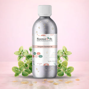 Bottle of Raasa Oils oregano essential oil with oregano leaves on a pink background