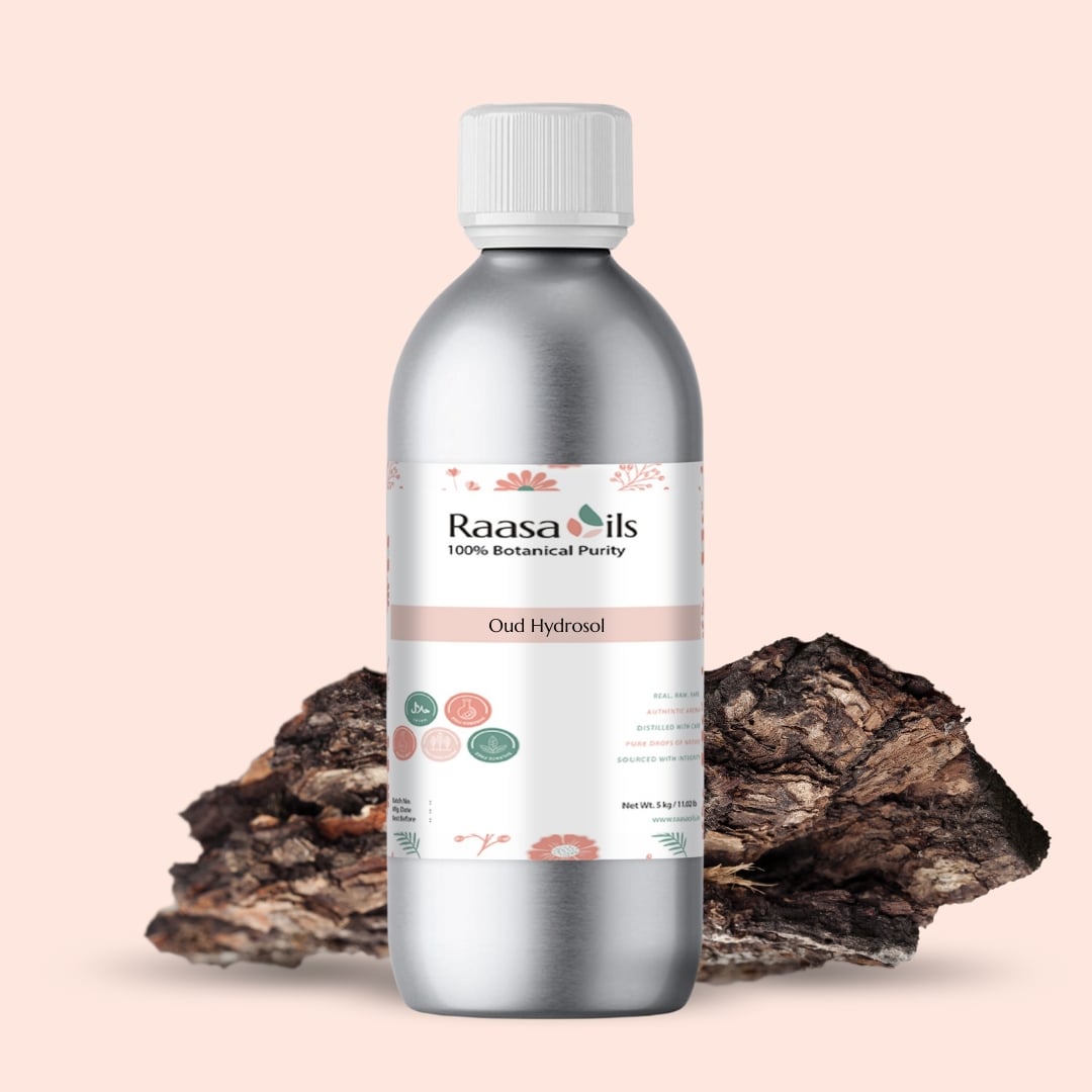 Bottle of Raasa Oils Oud Hydrosol with a natural wood background