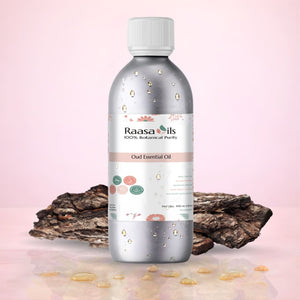 Bottle of Raasa Oils Oud Essential Oil with oud resin on a pink background