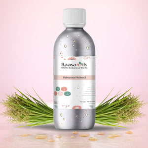 Raasa Oils Palmarosa Hydrosel bottle with green leaves on a pink background