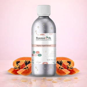 Bottle of Raasa Oils Papaya Liquid Extract with papaya slices on a pink background