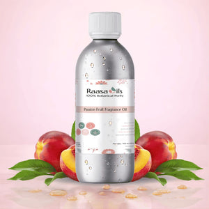 Bottle of Raasa Oils Passion Fruit Fragrance Oil with passion fruits and leaves on a pink background