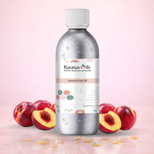Bottle of Raasa Oils Passion Fruit Oil with passion fruits and leaves on a pink background