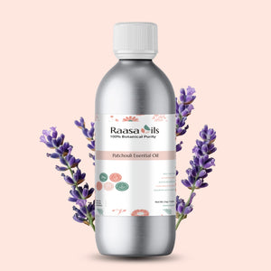 Raasa Oils Patchouli Essential Oil bottle with lavender flowers on a beige background