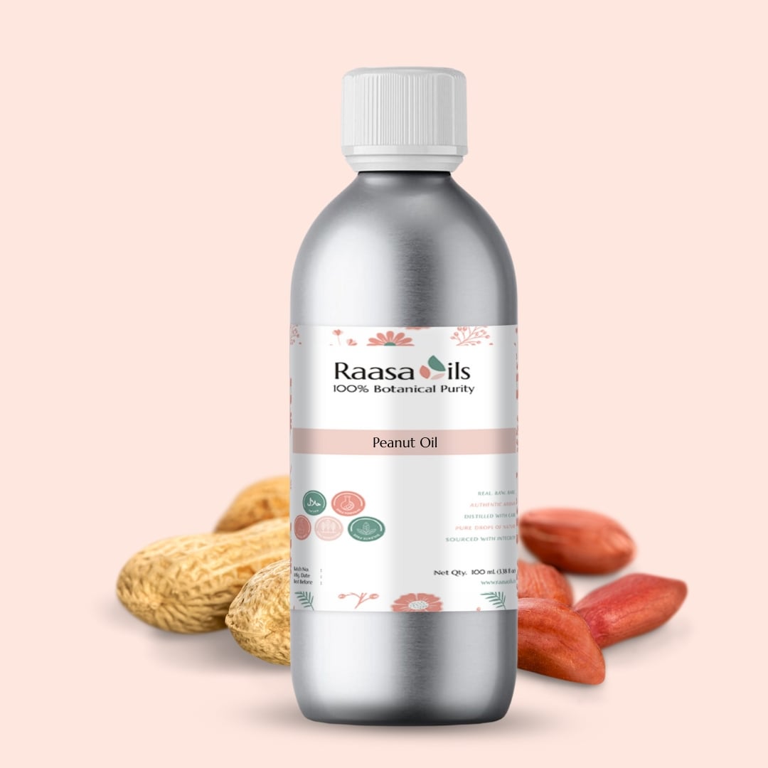 Bottle of Raasa Oils peanut oil with peanuts on a beige background