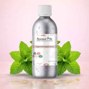Bottle of Raasa Oils Peppermint Liquid Extract with mint leaves on a pink background