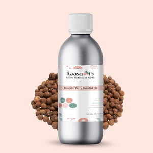 Bottle of Raasa Oils Pimento Berry Essential Oil with pimento berries on a light pink background